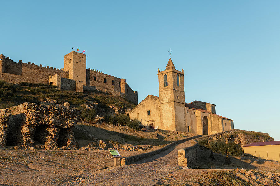 The Church Of Santiago Apostol And The Castle Of Medellin Seen At Sunset, Extremadura, Spain. Photograph