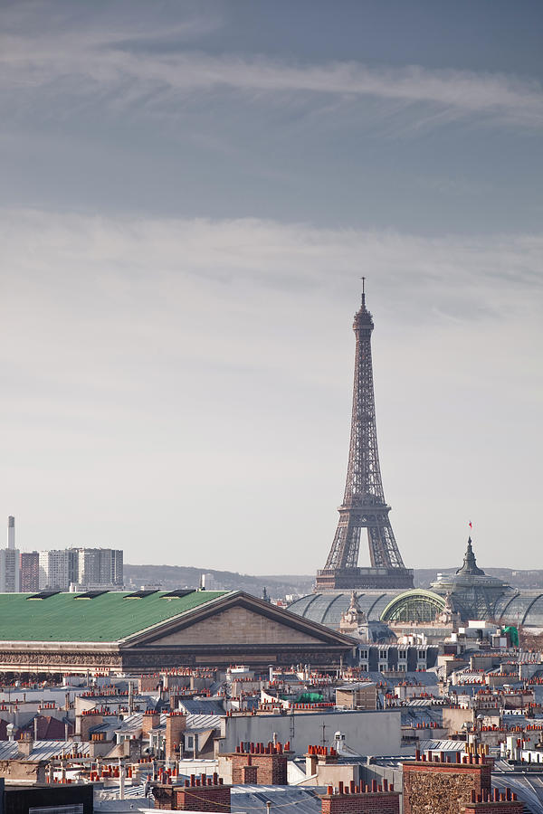 The Eiffel Tower Above The Rooftops Of Photograph by Julian Elliott Photography