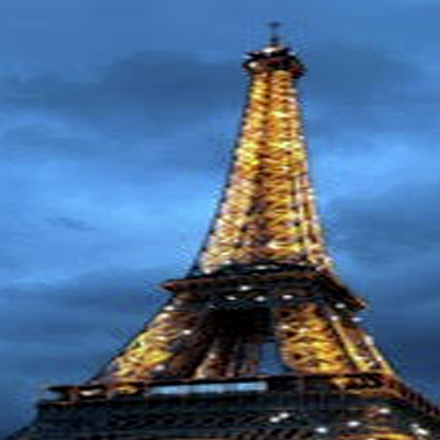 The Eiffel Tower at Night Photograph by Susan Grunin