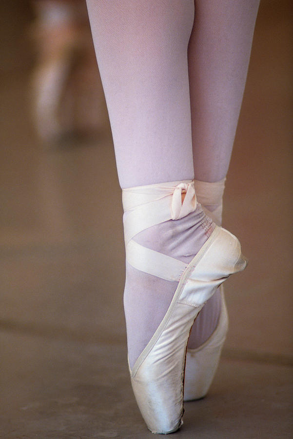 The Feet Of A Ballerina On Her Toes Photograph by Wesley Hitt