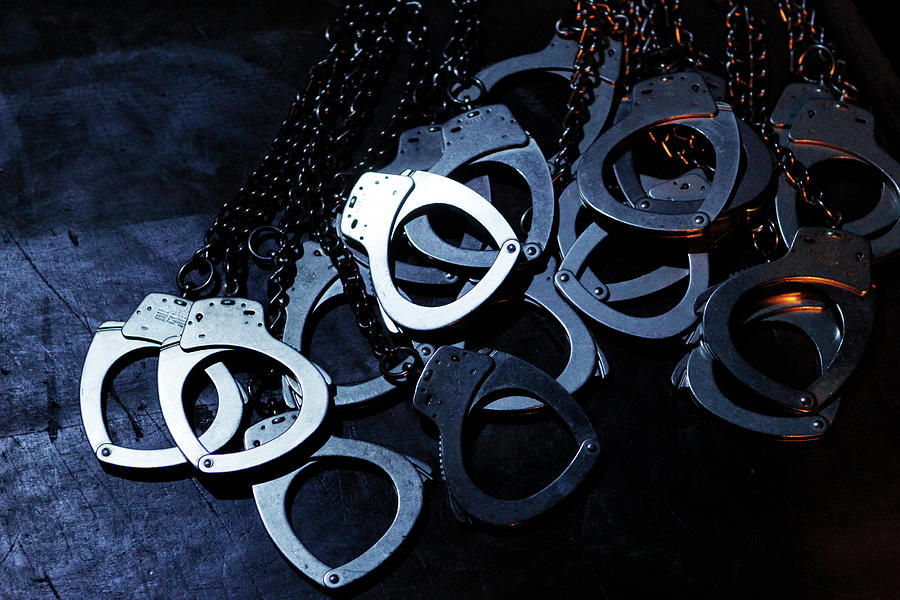 The Handcuffs of Inmates Are Seen Photograph by Enrique Castro-Mendivil ...