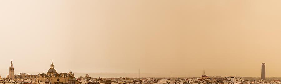The Haze In Seville March 16, 2022. Panoramic View Of La Giralda And Torre Sevilla Photograph by Nicols Alarcn Rapela