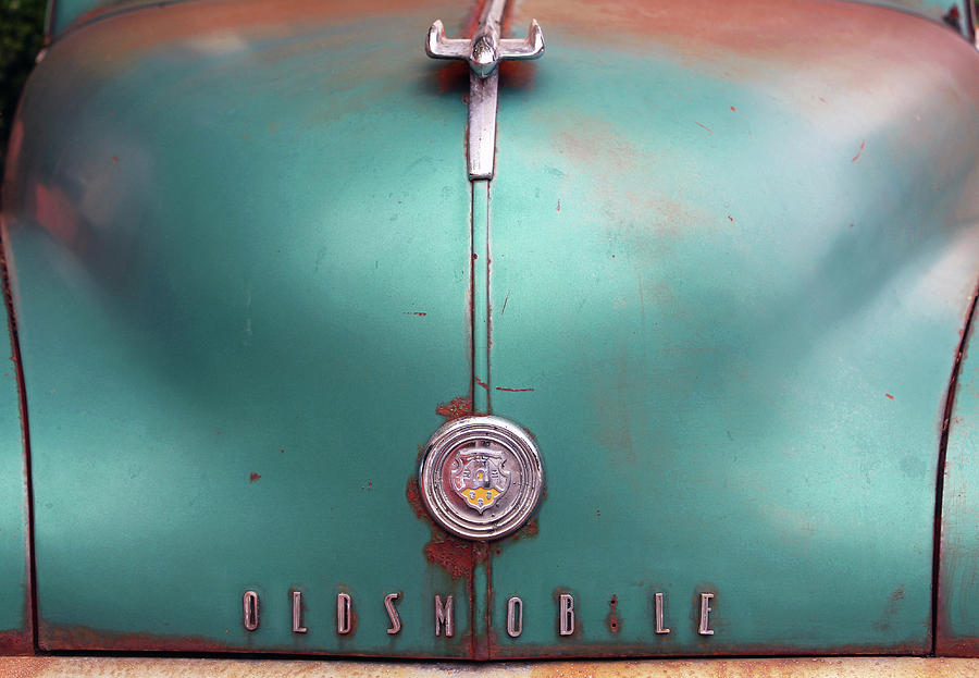The Hood Of An Old Oldsmobile Photograph by Cora Wandel