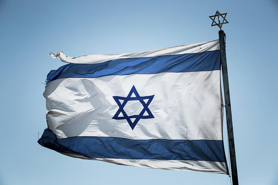 The Israeli flag with David star on the flag and on the top of the flag ...