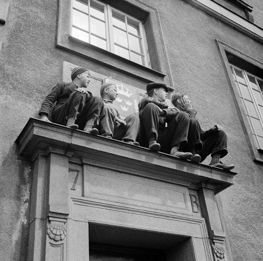 The little boys in the picture have come up with a good spot on the side door of the Swedish Embassy Painting by Celestial Images