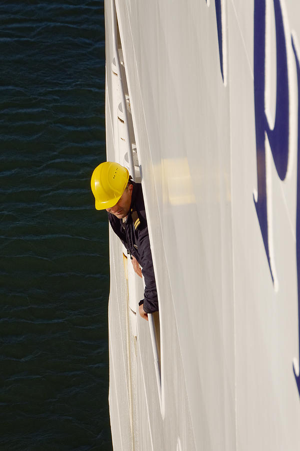 The Man in the Yellow Helmet --  Officer on the Norwegian Pearl Cruise Ship in San Francisco Photograph by Darin Volpe