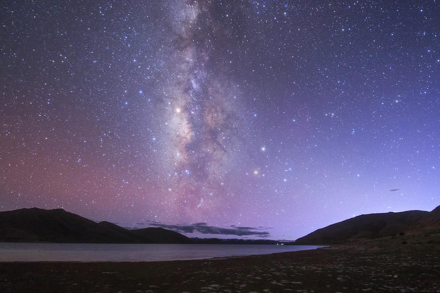 The Milky Way Shines In The Evening Photograph by Jeff Dai