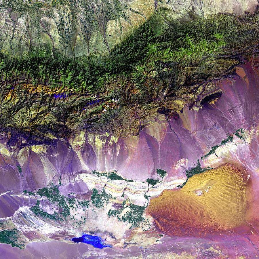The mix of sand dunes and salt lakes at the edge of the Bogda Mountains in China  by NASA Painting by Celestial Images