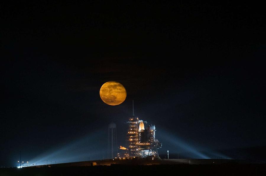 The moon is seen rising behind the Space Shuttle Endeavour on pad 39A Painting by Celestial Images