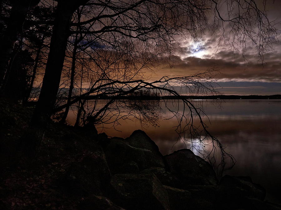 The moon the copper clouds and the lake Photograph by Jouko Lehto