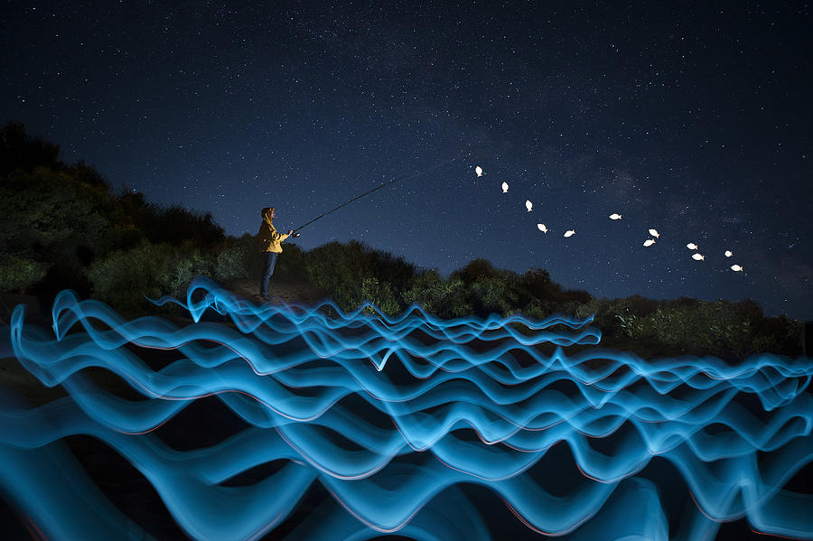 Night Photograph - The Night Fisherman by Deniz Ener