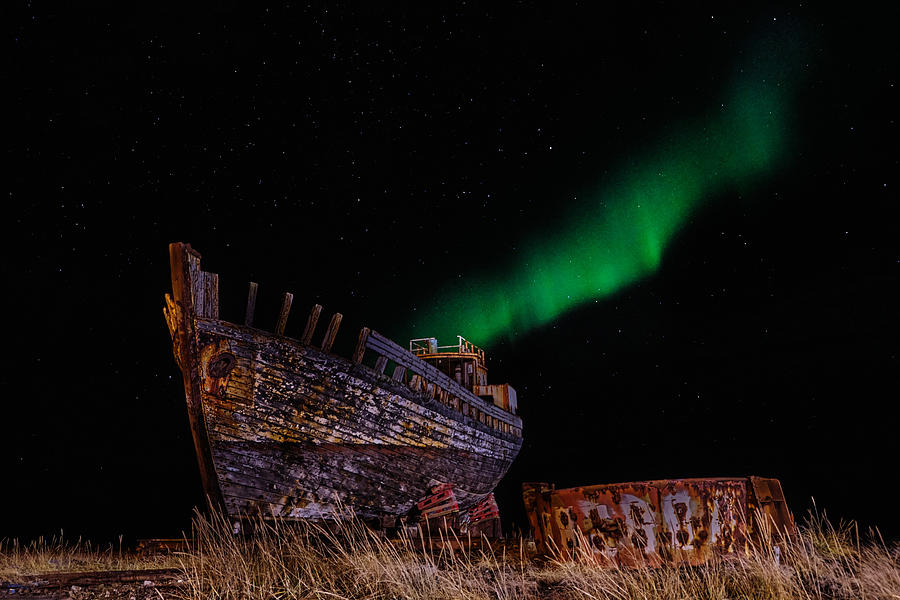 The Northern Lights Behind A Shipwreck Photograph by Avital Hershkovitz