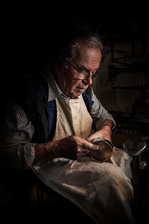 Portrait Photograph - The Old Shoemaker by Roberto Rampinelli