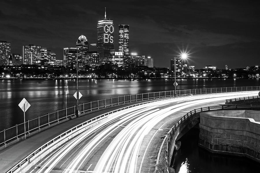 The Pru lit up for the Boston Bruins Boston MA Charles River Black and White Photograph by Toby McGuire