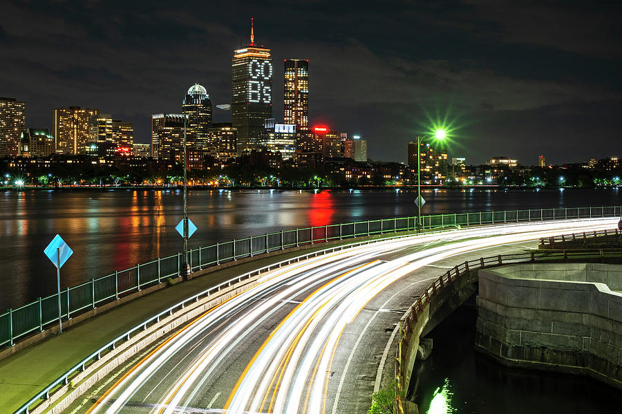 The Pru lit up for the Boston Bruins Boston MA Charles River Photograph by Toby McGuire