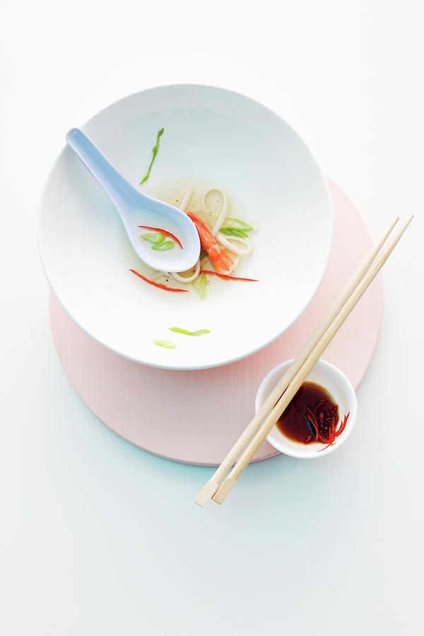 Holiday Photograph - The Remains Of Asian Noodle Soup On A Plate by Michael Wissing