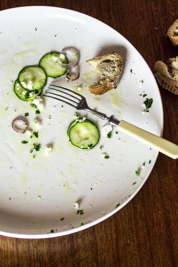 The Remains Of Courgette Carpaccio And Bread On A Plate With A Fork Photograph by The Stepford Husband