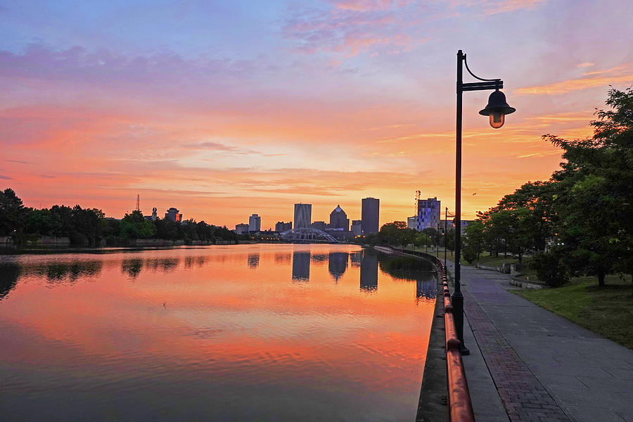 The Rochester Skyline at Sunrise Reflecting on the Genessee River Golden Sunrise Photograph by Toby McGuire