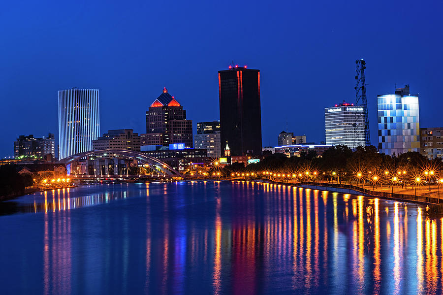 The Rochester Skyline reflecting the the Genesee River Rochester NY Deep Blue Sky Photograph by Toby McGuire