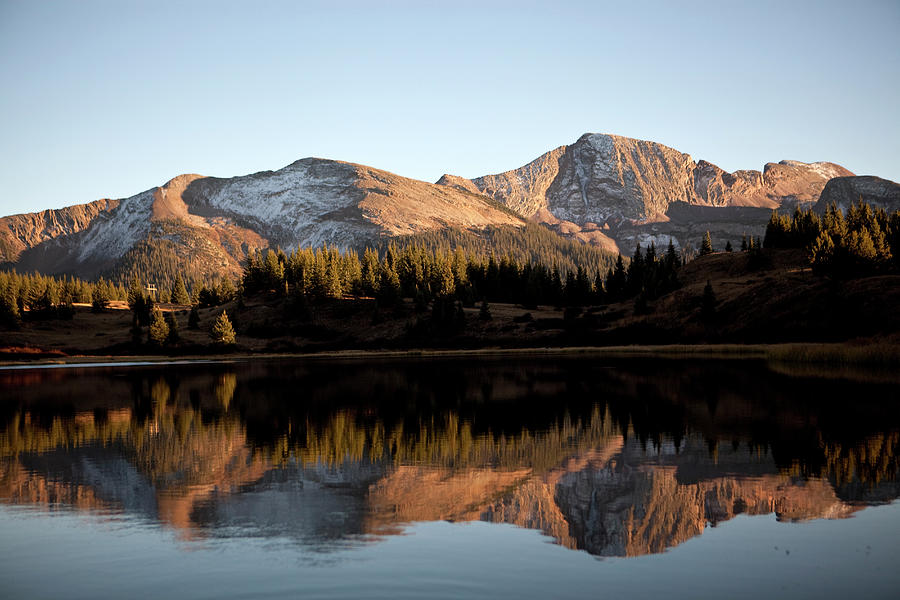 The Rocky Mountains Are Reflected In Photograph by Chris Bennett
