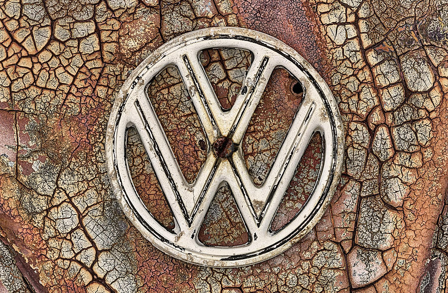 The Rusty VW Emblem  Photograph by JC Findley