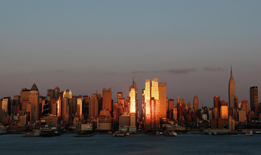 The Setting Sun Reflects off Buildings Photograph by Gary Hershorn