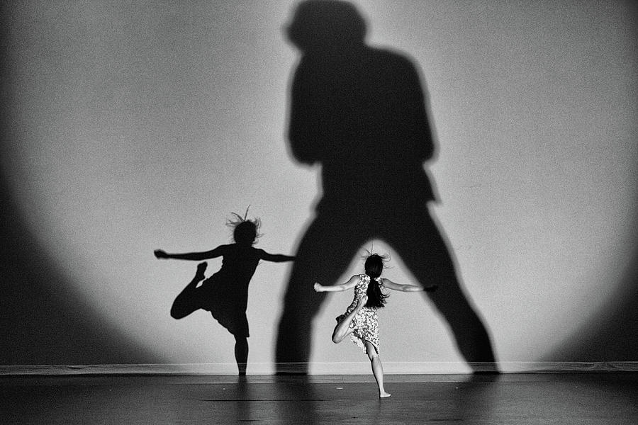 Black And White Photograph - The Singer And Dancers by Rob Li