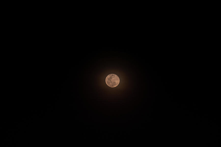 The Small full moon isolated over black background Photograph by Peerapun  Jodking - Pixels