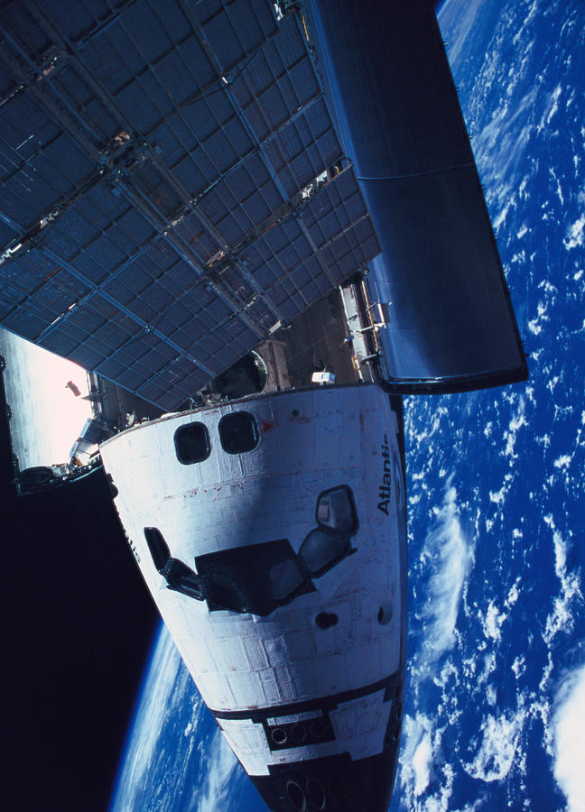 The Space Shuttle Docked With A Space Photograph by Stockbyte
