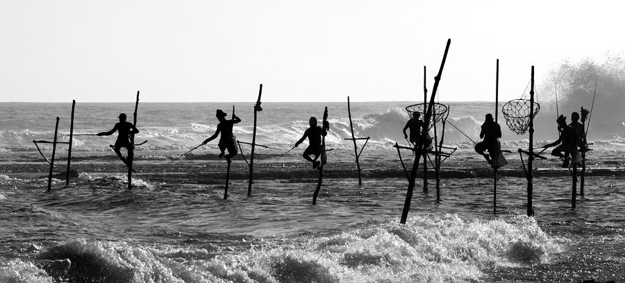 Fisherman Photograph - The Stick Fishermen by Yaniv Guy