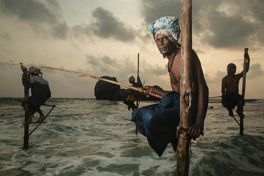 Beach Photograph - The Stilt Fisherman. by Giacomo Bruno