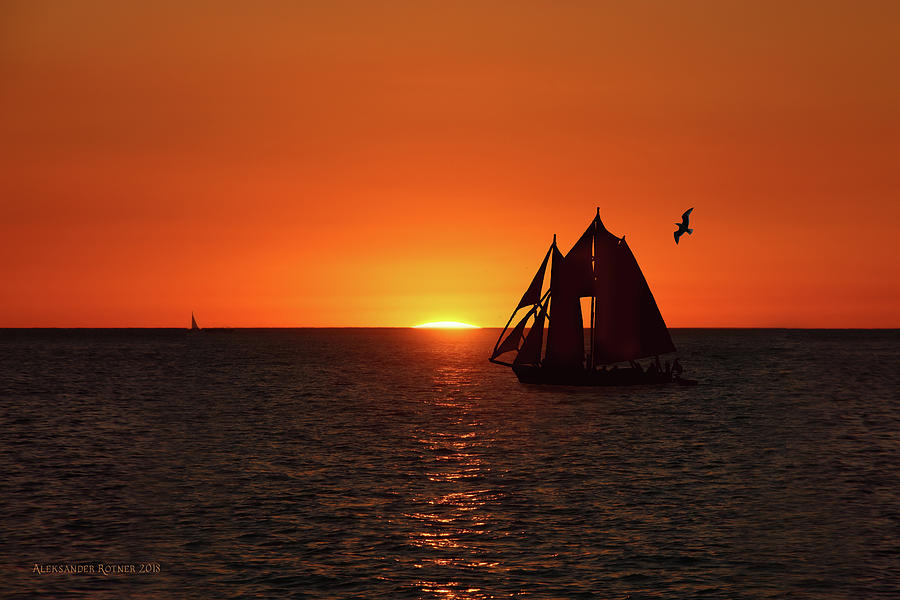 The Sunset with a Yacht Photograph by Aleksander Rotner
