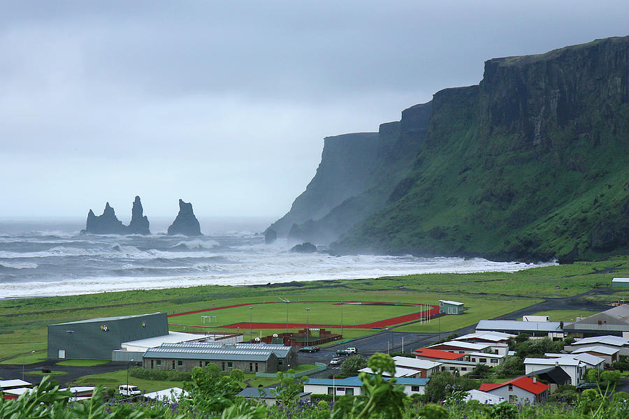 The Town Of Vík, Iceland Photograph by Andrea Schaffer