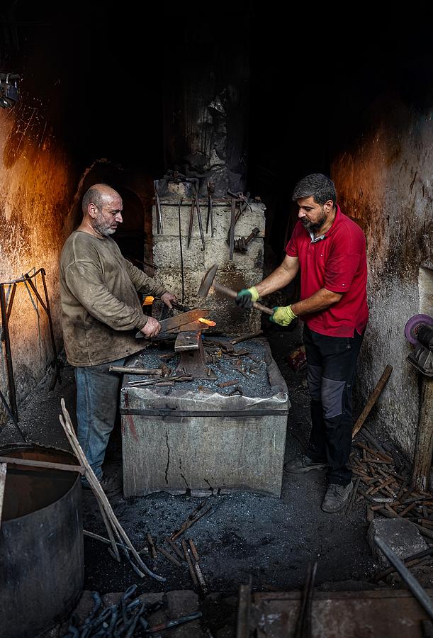 Men Photograph - The Traditional Blacksmithing by Bashar Alsofey