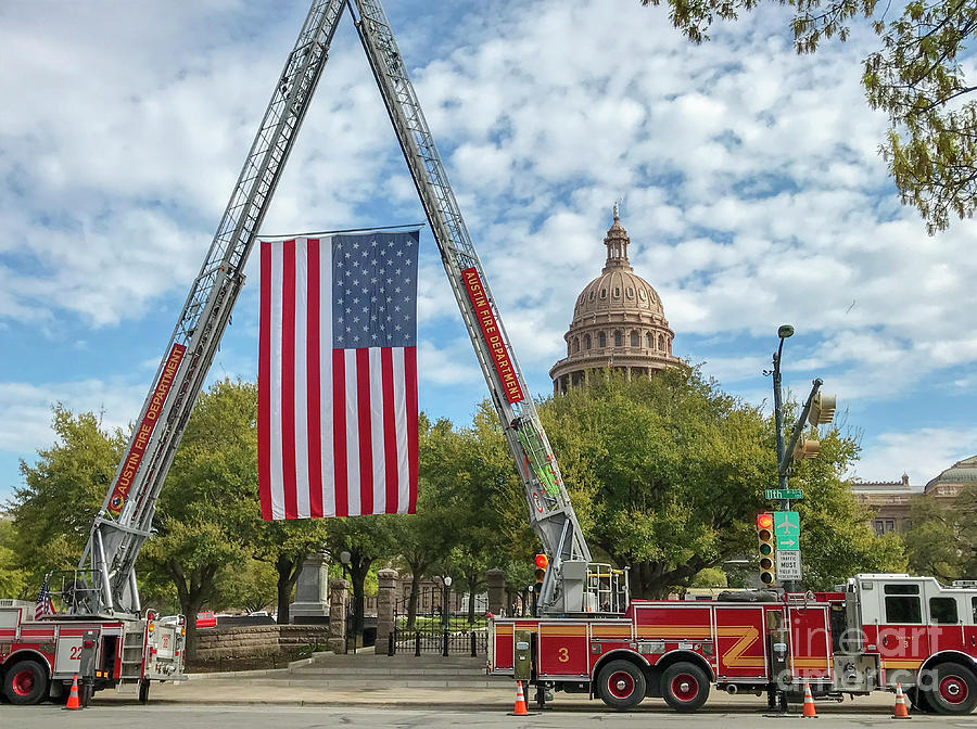 Austin Photograph - The US flag is hoisted by cranes on the Austin Fire Department f by Dan Herron