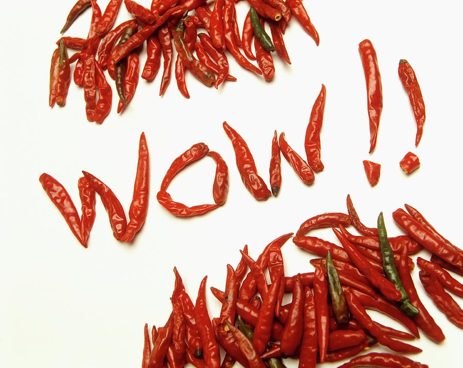 The Word wow!! Spelt Using Dried, Red Chilli Peppers Photograph by Paul Poplis