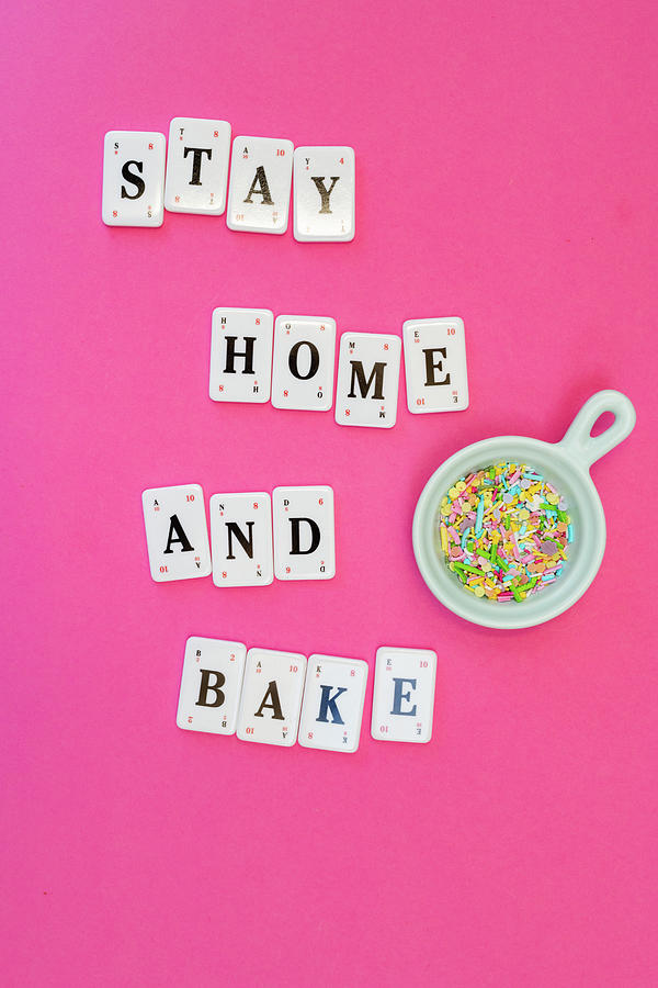 The Words Stay Home And Bake With Colourful Sugar Sprinkles Photograph by Lucy Parissi