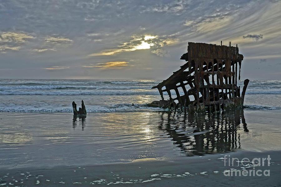 Sunset Photograph - The wreck of the  Peter Iredale at sunset by Jonathan Lingel