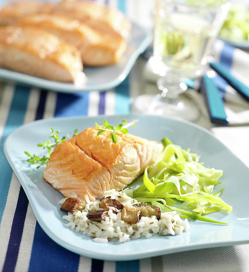 Thick Piece Of Salmon With Rice And Mushrooms, Aubergines And Tender Leeks Photograph by Bertram