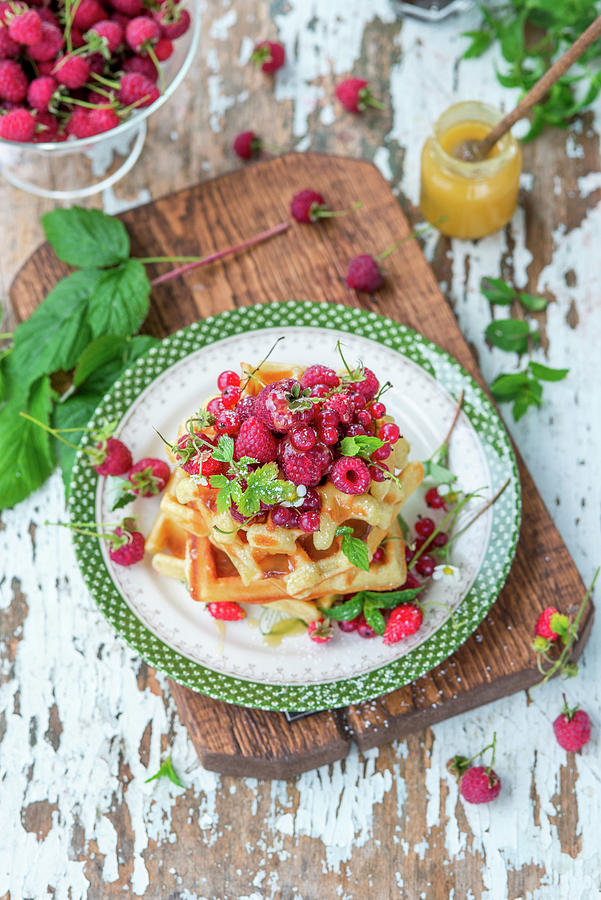 Thick Waffles With Berries And Honey Photograph by Irina Meliukh