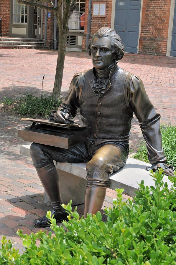 Thomas Jefferson, sits on a bench on Market Square in Colonial ...