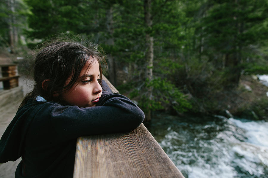 Nature Photograph - Thoughtful Girl Looking Away While Leaning On Bannister At Inyo National Forest by Cavan Images