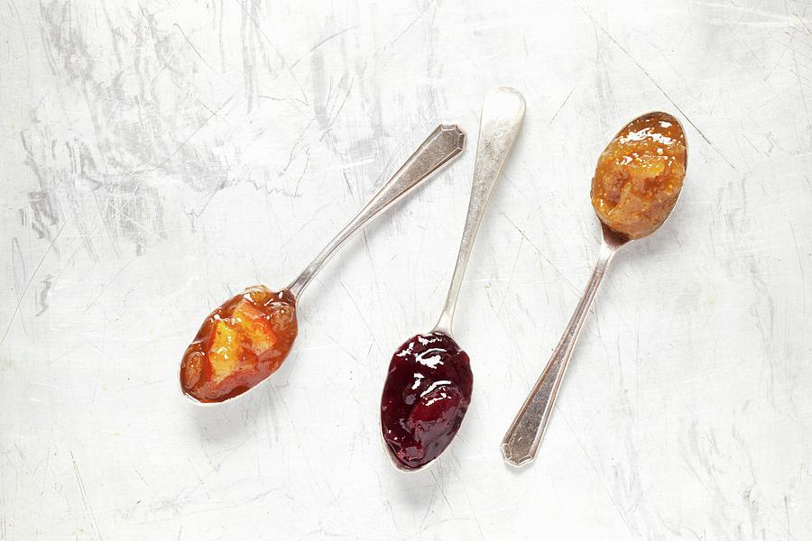 Three Antique Jam Spoons On A Metal Surface Photograph by Jane Saunders