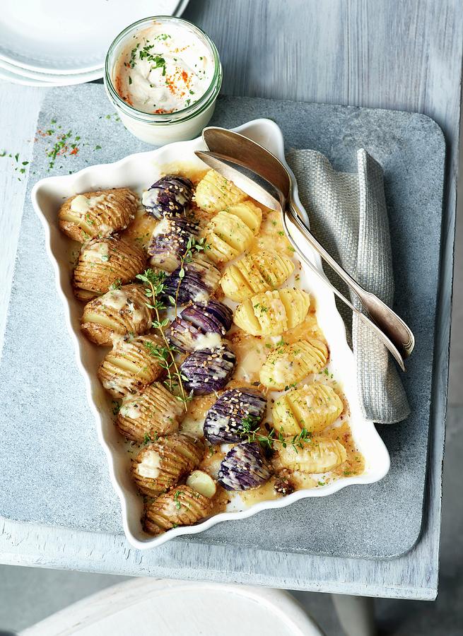 Three Baked Potatoes Varieties With A Garlic Dip Photograph by Stefan Schulte-ladbeck
