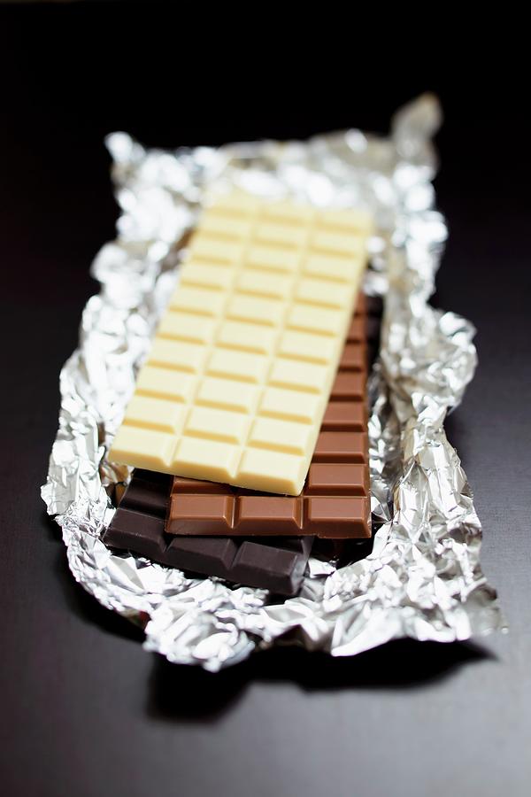 Three Bars Of Chocolate white Chocolate, Milk Chocolate, Dark Chocolate Photograph by Sporrer/skowronek