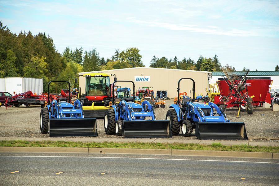 Three Blue Tractors Photograph by Tom Cochran