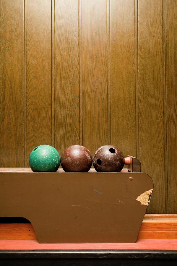 Ball Photograph - Three Bowling Balls In Bowling Alley by Benne Ochs