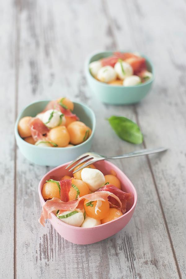 Three Bowls Of Melon Salad With Mozzarella Balls And Parma Ham Photograph by Jan Wischnewski