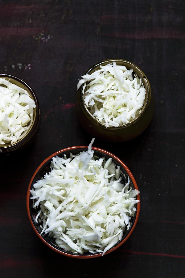 Three Bowls Of Shredded White Cabbage Photograph by Adel Bekefi