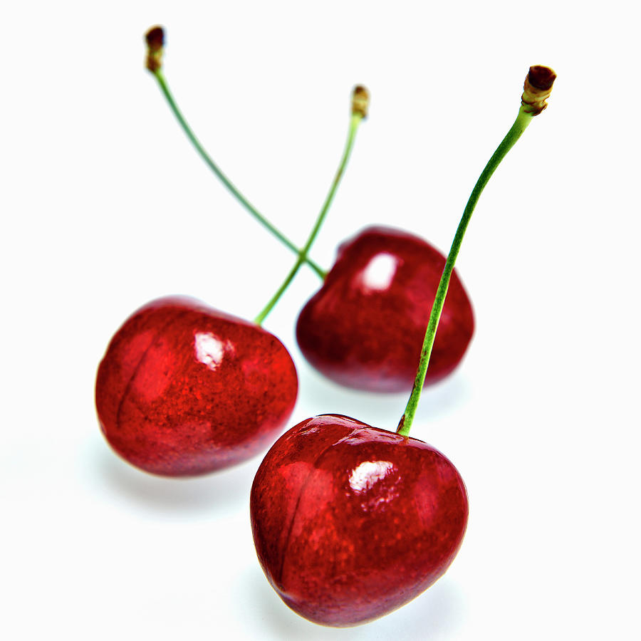 Three Cherries In Front Of A White Background Photograph by Shawn Driman Photography